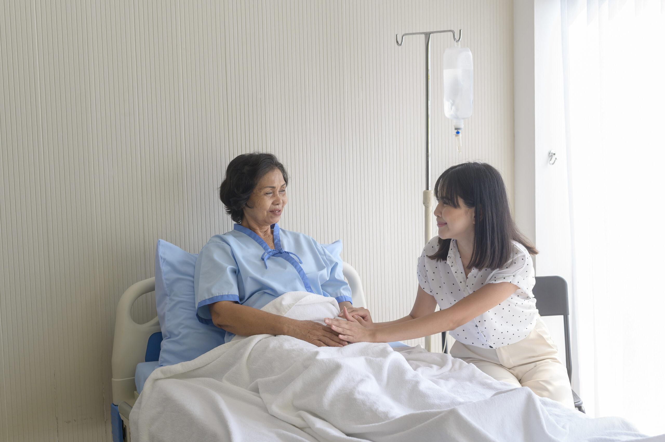 Hospice nurse helping patient with wound care