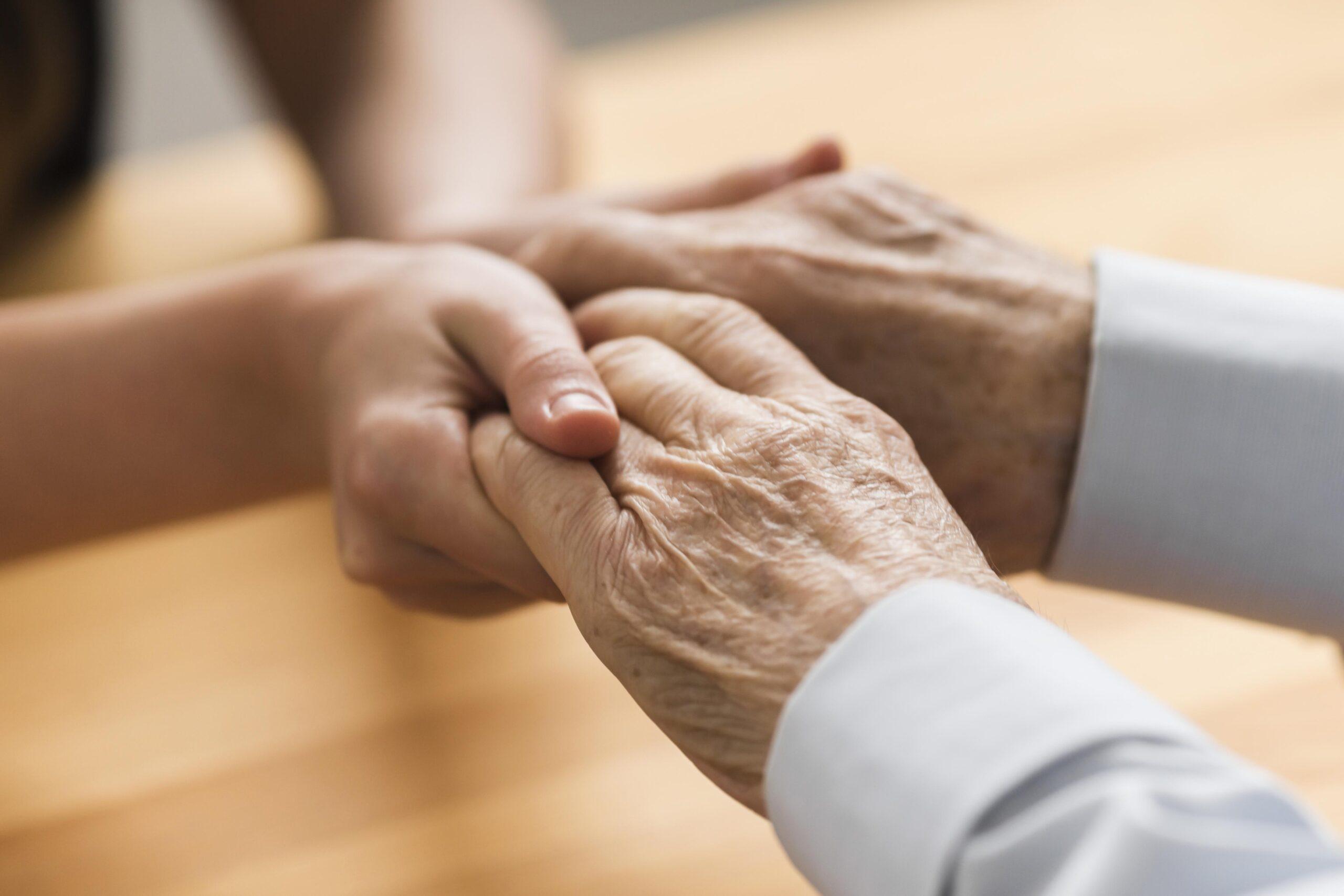 hospice training for changes in elimination holding hands